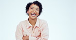 Arms crossed, smile and funny with face of woman in studio for comedy, joke or carefree. Happy, cheerful and pride with portrait of person laughing on white background for crazy, positive and humor