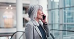 Talking, corporate and a mature woman on a phone call for business, networking or conversation. Office, work and an Asian manager or company ceo speaking on a mobile for communication or discussion