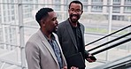 Escalator, discussion and business men in a building talking before a corporate meeting or seminar. Conversation, friends and African male lawyers speaking on moving stairs in airport or hotel lobby.