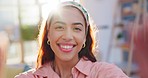 Home, selfie and woman with a smile, face and funny with humor, carefree and lens flare in a living room. Portrait, person and girl in a lounge, post and profile picture with social media and memory