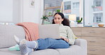 Woman relax, sofa and laptop for home internet, e learning and online education or movie streaming service. Young african person on couch, computer and living room with remote work, website and blog