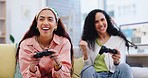 Women friends, sofa and controller for video game, relax and online challenge in home living room. Girl, gaming and excited people on couch, lounge and competition with comic push with celebration