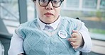 Face, vote and a woman in a wheelchair pointing to a badge in support of freedom or democracy. Portrait, proud and a female with a disability in the election for choice or decision of political party