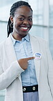 Vote, arms crossed and an african woman pointing to a badge in support of freedom or democracy in politics. Portrait, smile and happy with her choice, decision or selection in a political election