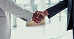 Business people, handshake and meeting in partnership, deal or agreement together at the office. Closeup of employees shaking hands in support, teamwork or thank you and welcome at the workplace