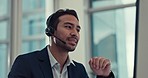 Businessman, call center and consulting in customer service, support or telemarketing at the office. Asian man, consultant or agent talking with headphones in online advice or help at the workplace