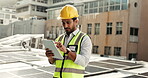 Tablet, solar panel and a construction worker man on a roof in the city to install alternative energy equipment, Technology, building and sustainability with an engineer or electrician at work