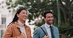Laughing, business people and walking together outdoor for travel and chat in city. Professional man and woman on commute, adventure or journey on urban road with communication or funny discussion