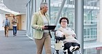 Business women, wheelchair and discussion in office hallway on tablet, schedule or teamwork in workplace. Mature manager, partnership and person with disability for ideas, talk or digital touchscreen