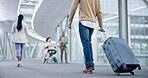 Back, walking and luggage of people in airport to travel, global vacation or holiday in airline lobby. Suitcase, person and rear at flight terminal, immigration journey or international airplane trip