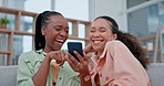 Girl friends, phone and meme in home living room, comic laugh and happy with video, point or click on sofa. Women together, smartphone and funny post on blog, social network and mobile app in house