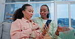 Couple of friends, phone and women talking on a home sofa for gossip, website or internet. Relax, lesbian people and together on a couch with a smartphone for communication, search or social media