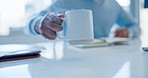 Person, drink and hand on coffee cup with steam or employee working in office with hot chocolate, beverage or tea. Drinking, mug and businessman at desk with planning for business or workplace 