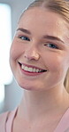 Portrait, smile and face of young woman with clean skin, happiness and positive attitude. Headshot of happy and natural person with perfect teeth and confidence in health and wellness from Australia