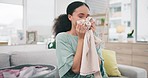 Laundry, fabric and a woman smelling a scarf in her home while spring cleaning in her home for hygiene. Fresh, material or aroma with a happy young person in an apartment for housework or chores