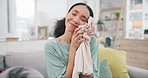 Clean laundry, woman and smile with soft fabric texture of blanket in a living room and relax. Home, cleaning and happy person from cotton textile and housekeeping with chores and washing routine