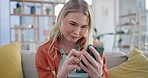 Woman, smartphone and scroll on sofa in home, reading social media notification and app. Happy gen z girl typing on cellphone for digital chat, download mobile games and search network in living room