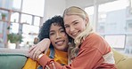 Couple of friends, hug and women on couch for bonding, affection and relax together for lesbian relationship. Love, social and portrait of people embrace for trust, happiness and care in living room