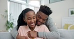 Home, hug and black couple with love, smile and bonding with relationship, marriage and happiness in a living room. Romance, man or woman embrace, affection and care with romantic and loving together