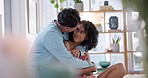 Hug, home and couple with love, care and support in a living room with relax and bonding. Embrace, happy young people and discussion in a house with a woman and man together with romance and talj
