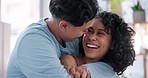 Love, happy and lesbian couple hugging in the living room of their modern apartment for romance. Smile, laugh and young lgbtq women and embracing with care and bonding together in the lounge at home.