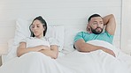 Fighting, divorce and upset couple in the bed for break up drama, crisis or conflict at home. Silence, angry and sad young man and woman in an argument for toxic relationship in the apartment bedroom