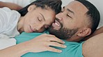 Happy, talking and a couple with a hug in bed for comfort, bonding or cuddling. Smile, talking and a man and woman in the bedroom of a house for sleeping, conversation or love together in marriage