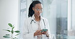 Woman, smartphone and doctor typing in hospital for online contact, reading healthcare notification or telehealth info. Medical worker, african surgeon or search mobile app for digital clinic network