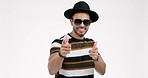 Fashion, finger gun and man on a white background pointing with trendy clothes, style and outfit. Happy, relax and portrait of isolated confident person with hand gesture, symbol and emoji in studio