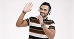 Man, headphones and dance with smartphone, singing in studio and celebrate freedom of party on white background. Happy indian model dancing with cellphone, listening to rave music or energy for radio