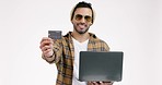 Man, credit card and laptop in studio, online shopping and face for investing, bills or payment by white background. Trader, fintech app and computer with smile, cybersecurity and e commerce on web