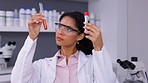 Scientist, woman and chemical in test tube, blood and medical research with analysis and comparison in lab. Review, liquid solution and test, investigation and science study, knowledge and DNA sample