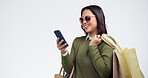 Happy woman, phone and shopping bag in social media, payment or fashion against a grey studio background. Female person or shopper smile on mobile smartphone in ecommerce, sale or discount on mockup