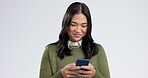 Happy woman, phone and typing for social media, communication and networking in studio. Young asian person on mobile for chat, internet search and contact, opportunity or website on white background