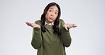 Face, confused and Asian woman with question, shrugging or emoji on white studio background. Portrait, person or girl with gesture for uncertainty, doubt or unsure with reaction, puzzles or confusion