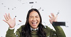 Happy asian woman, confetti and celebration in winning, promotion or achievement against a grey studio background. Portrait of excited female person smile in happiness for prize, party or victory