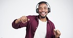 Headphones, music and man face dance in studio celebration with news, feedback or promo on white background. Freedom, happy and portrait of guy dancing to earphones radio, podcast or audio streaming
