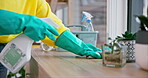 Cleaner, hands and person with spray, cleaning furniture and chemical with hygiene and gloves, disinfection and product. Hospitality, housekeeping and service with janitor, house work and detergent