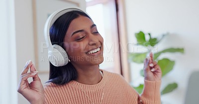Dance, headphones and young woman in the living room listening to music ...