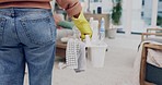 Cleaning, woman and back in living room for maid, housekeeper and maintenance work. Home, chemical bottle and hygiene for cleaner service and care with wash product and spray in a house lounge