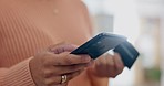 Hands, woman and credit card with phone for online shopping, digital payment and fintech at home. Closeup of customer, mobile banking and finance for sales, ecommerce password and financial economy 
