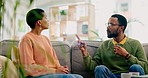 Divorce, stress and couple on sofa with problem, argue or angry for jealousy, lies or debt at home. Marriage, conflict and frustrated man with black woman in living room for dispute, fail or crisis