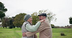 Dancing, senior couple and outdoor at a park with fun energy, happiness and love on holiday. Elderly man and woman in nature for a spin, funny adventure and celebration of retirement and freedom