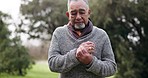 Old man, hand and pain with arthritis and health, muscle or joint ache, massage and tension while outdoor. Retirement, pension and medical emergency, inflammation and 
tendinitis with sprain