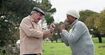 Senior couple, dance and outdoor at a park with fun energy, happiness and love on holiday. Interracial, elderly man and woman in nature for funny adventure and celebration of retirement and freedom