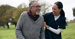 Healthcare, smile and old man with nurse in park for walk together with help, support and nature. Senior care, elderly patient and happy woman caregiver in conversation garden for fresh air or physio