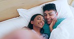 Couple, bed and selfie with kiss, smile and face with care, love and romance in morning, wake up and home. Man, woman and partnership with memory, photography or portrait for vacation on social media