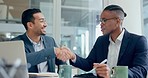 Laptop, meeting and handshake with business men in agreement of a deal in the boardroom of their workplace. Computer, strategy or discussion with an employee team shaking hands in partnership