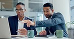 Laptop, strategy and planning with business men talking in the boardroom of their corporate workplace. Computer, meeting or discussion with a employee team working on marketing, innovation or design