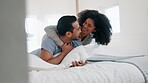 Hug, talking and couple in bed, happy and bonding together in home to cuddle. Embrace, interracial love and man and woman smile in bedroom in conversation, healthy connection and relax in the morning